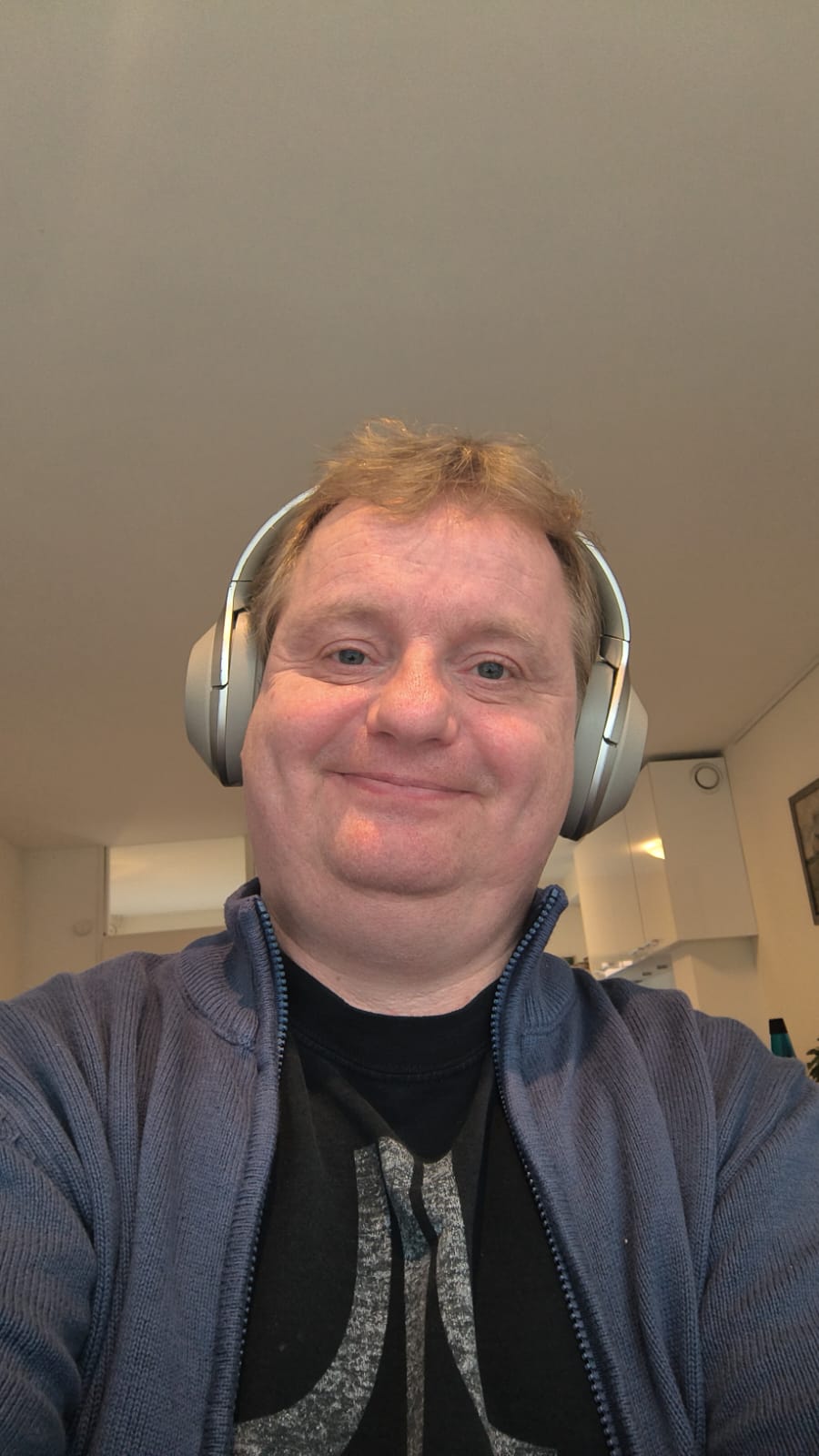 Sidney on October 6, 2025, wearing an ancient Atari t-shirt and headphones.